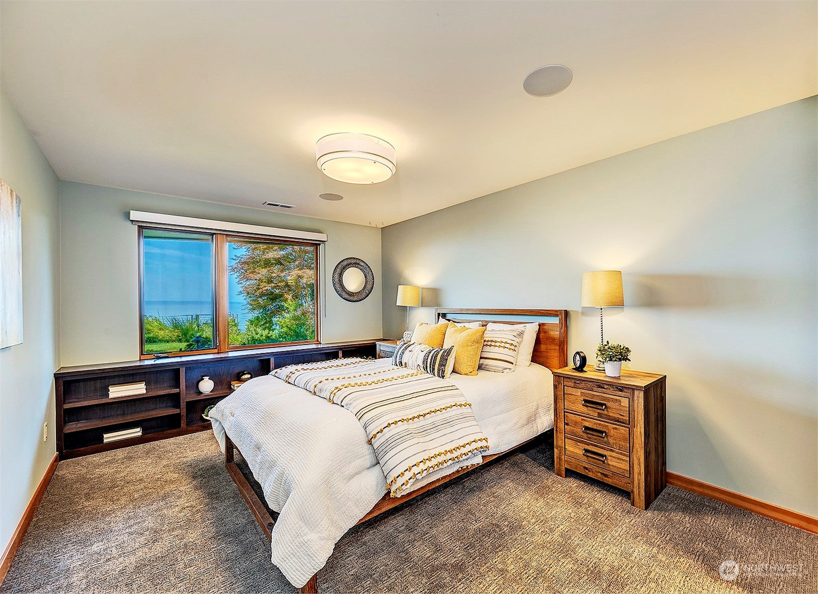 16902 Talbot Road Edmonds, WA 98026 - Photo 28 of 38 a bedroom with a bed and a window