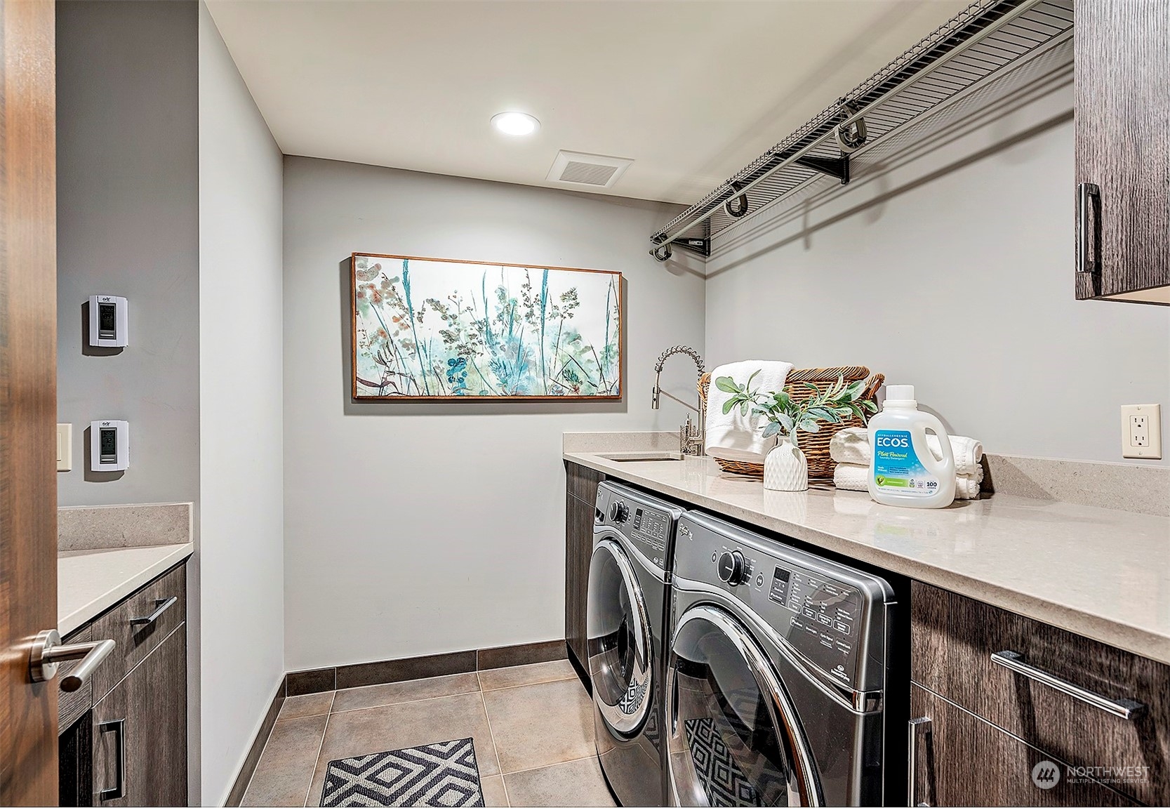 16902 Talbot Road Edmonds, WA 98026 - Photo 30 of 38 a utility room with cabinets washer and dryer
