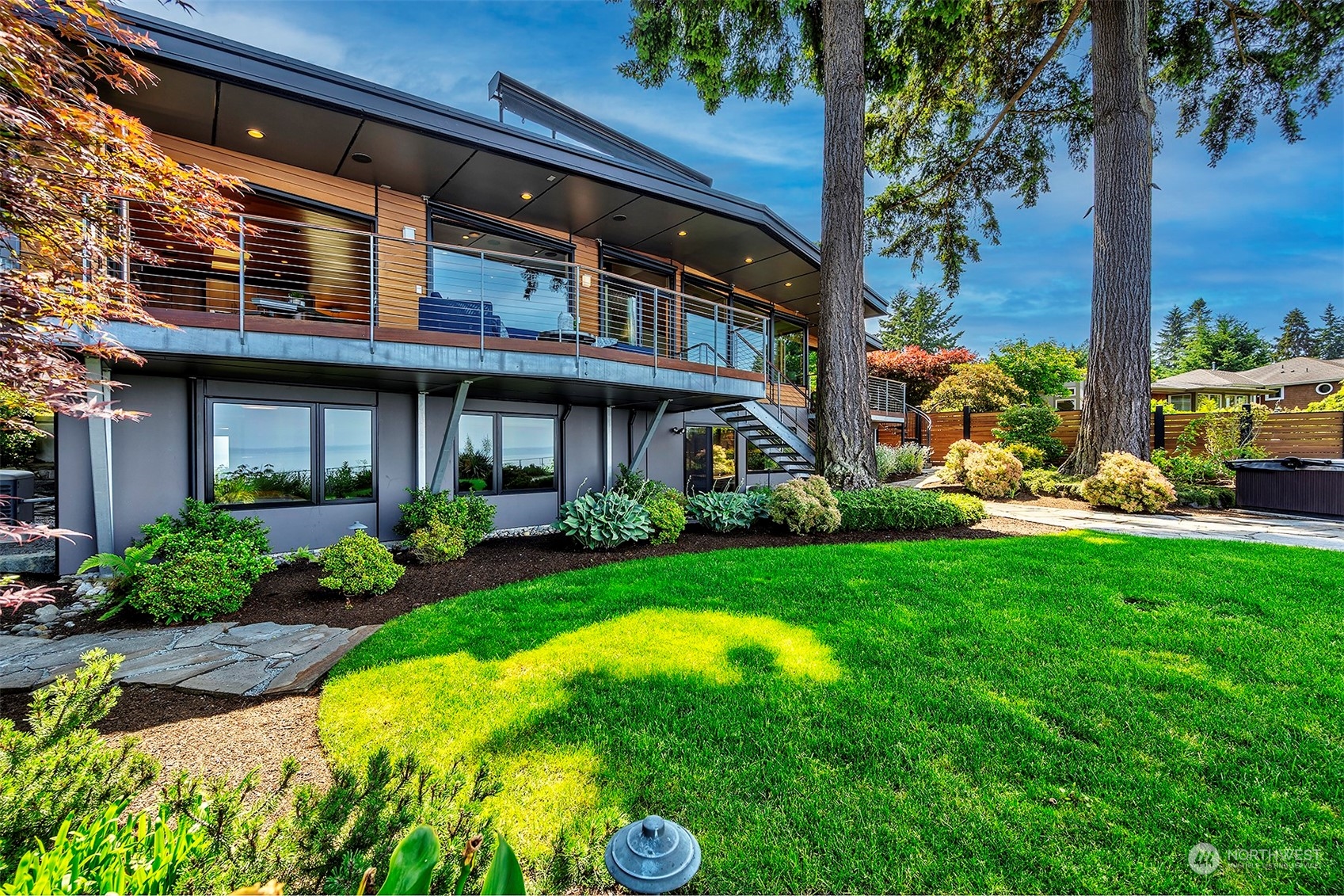 16902 Talbot Road Edmonds, WA 98026 - Photo 32 of 38 a view of a house with a yard potted plants and a large tree