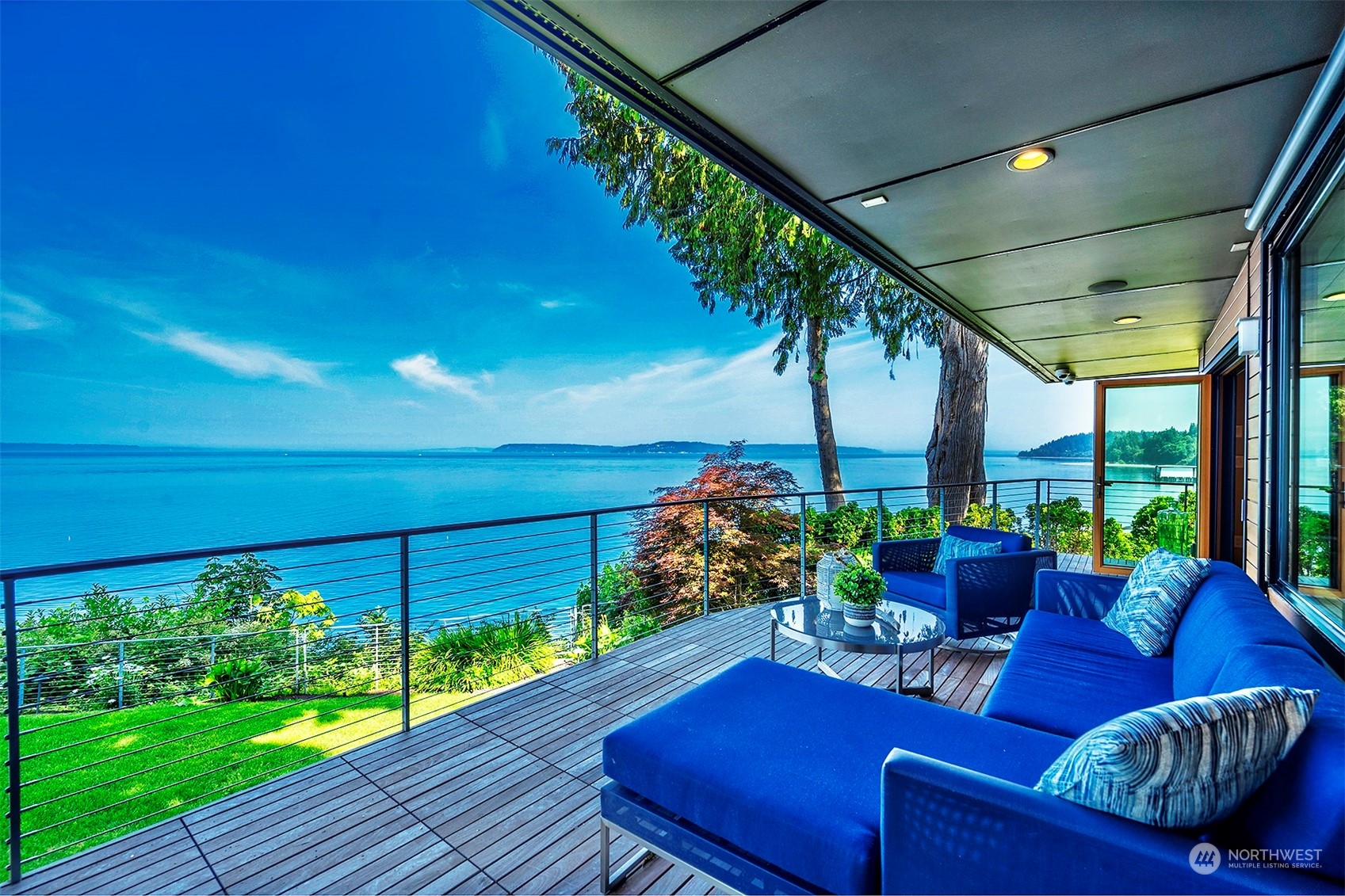 16902 Talbot Road Edmonds, WA 98026 - Photo 9 of 38 a view of a patio with couches chairs potted plants and ocean view