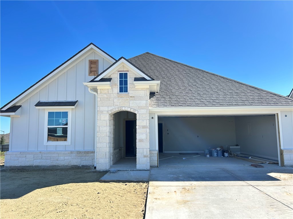 a front view of a house with garage