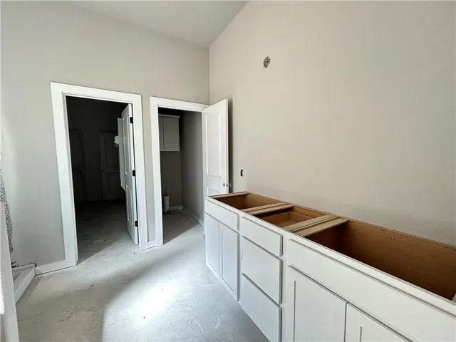 a kitchen with a sink and cabinets
