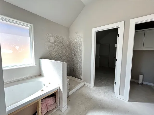 a view of room with furniture and wooden floor