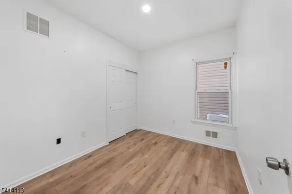 a view of a room that has a window in it