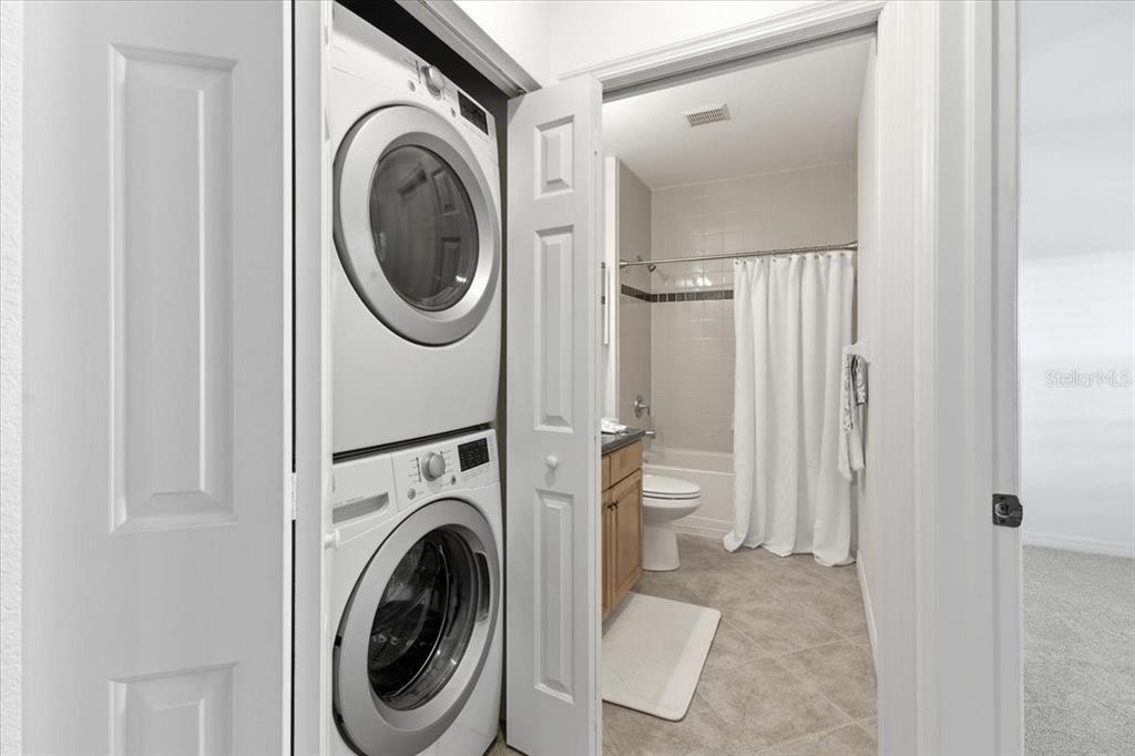 8411 Placida Road, Unit 407 Placida, FL 33946 - Photo 26 of 43 a view of a hallway with washer and dryer