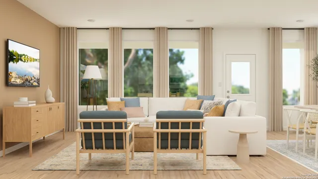 a view of a livingroom with furniture and windows