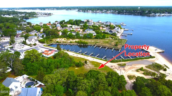an aerial view of a house with a lake view