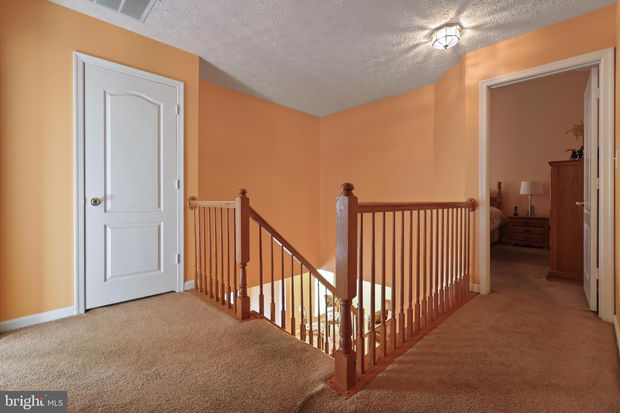 9716 Penguin Place Upper Marlboro, MD 20772 - Photo 11 of 84 a view of a hallway view with staircase