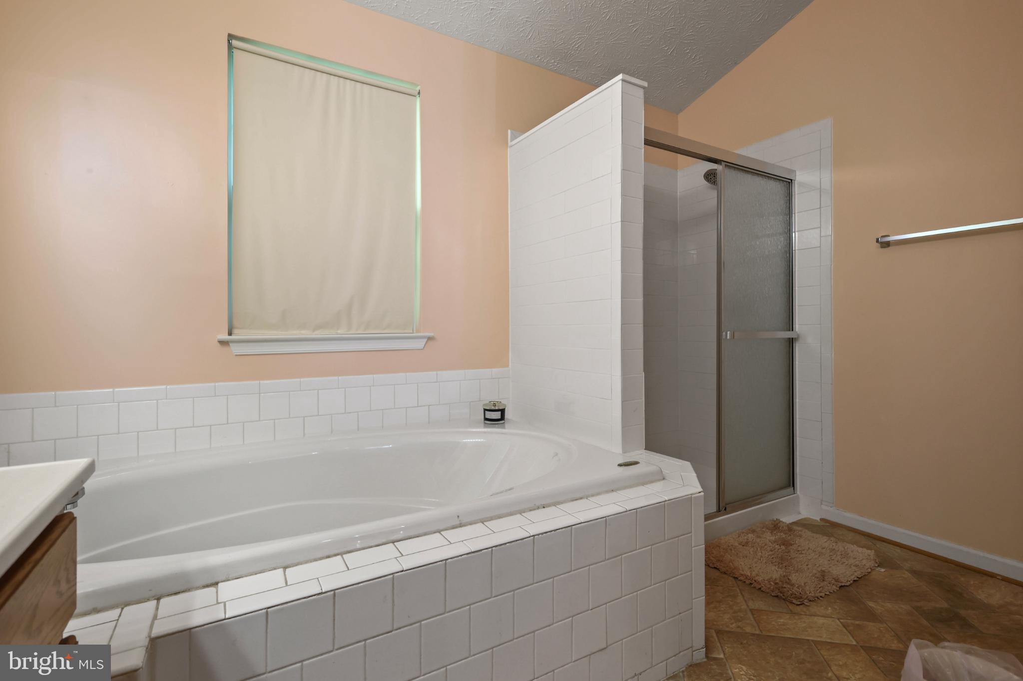 9716 Penguin Place Upper Marlboro, MD 20772 - Photo 19 of 84 a bathroom with bathtub and shower