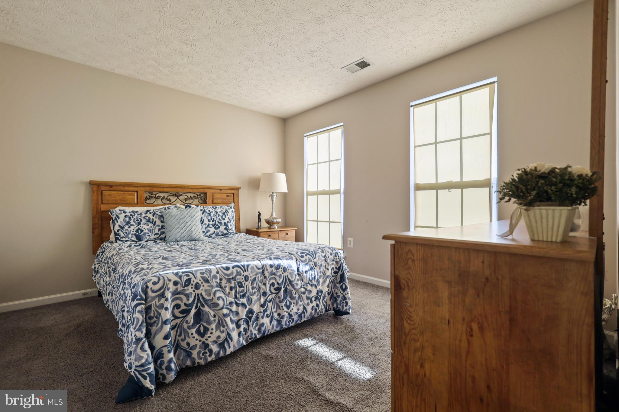 9716 Penguin Place Upper Marlboro, MD 20772 - Photo 26 of 84 a bedroom with a bed and window
