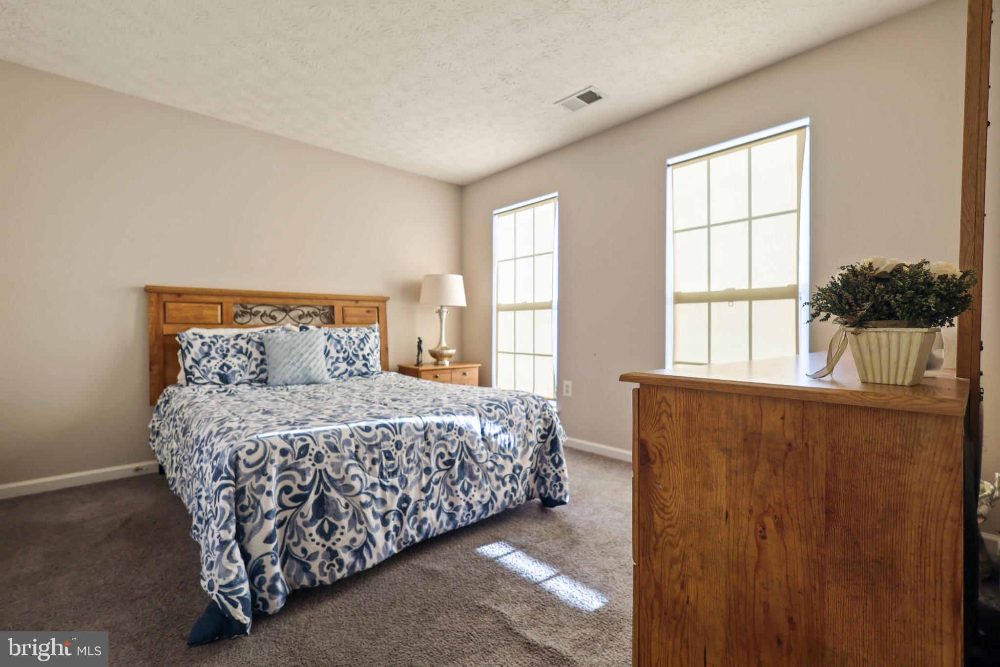 9716 Penguin Place Upper Marlboro, MD 20772 - Photo 27 of 84 a bedroom with a bed and window