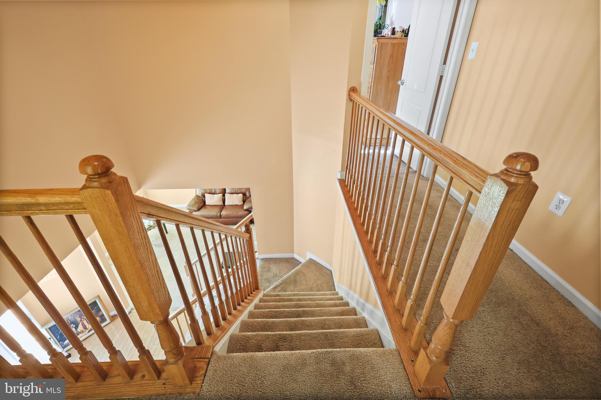 9716 Penguin Place Upper Marlboro, MD 20772 - Photo 29 of 84 a view of staircase with railing and white walls