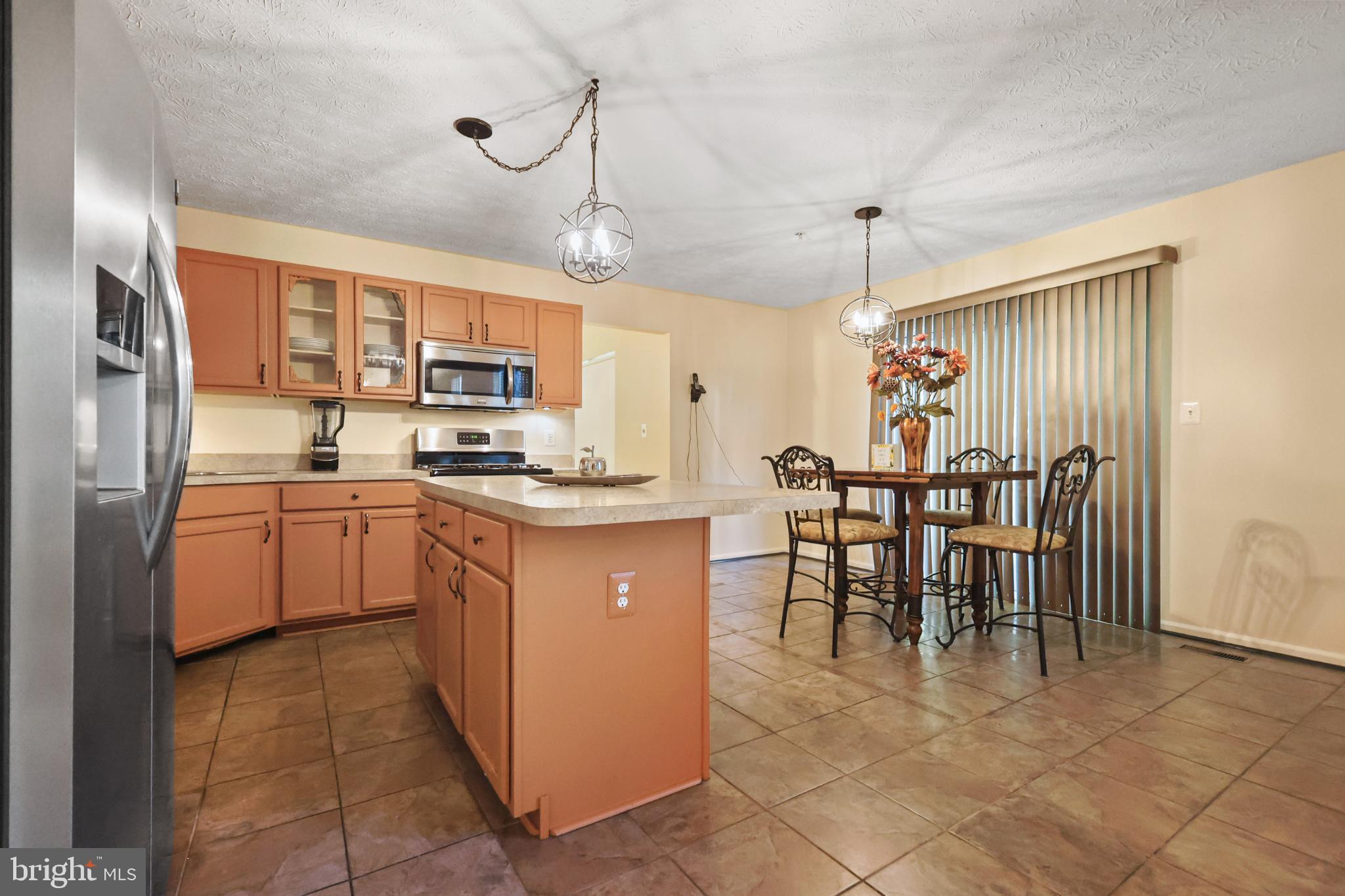 9716 Penguin Place Upper Marlboro, MD 20772 - Photo 3 of 84 a kitchen with cabinets a sink and appliances