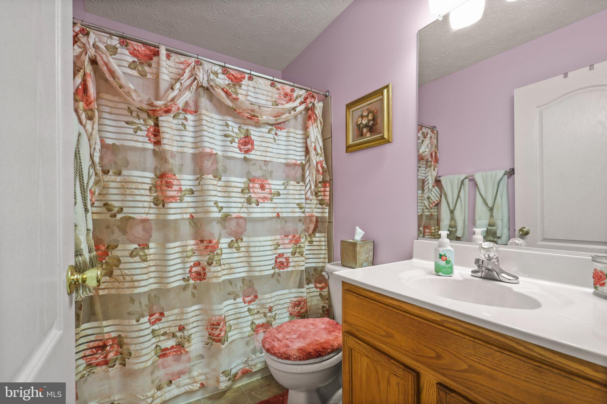 9716 Penguin Place Upper Marlboro, MD 20772 - Photo 32 of 84 a bathroom with a sink toilet and shower