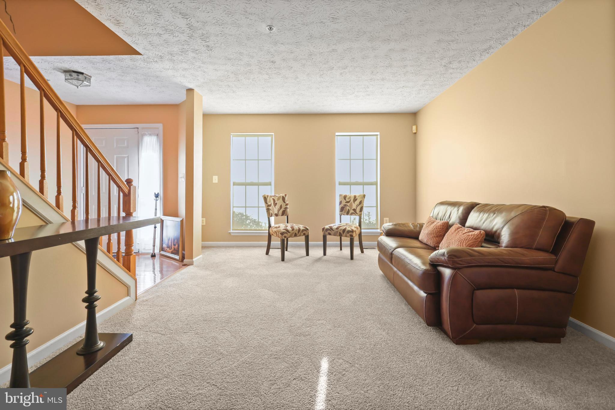 9716 Penguin Place Upper Marlboro, MD 20772 - Photo 33 of 84 a living room with furniture and a large window