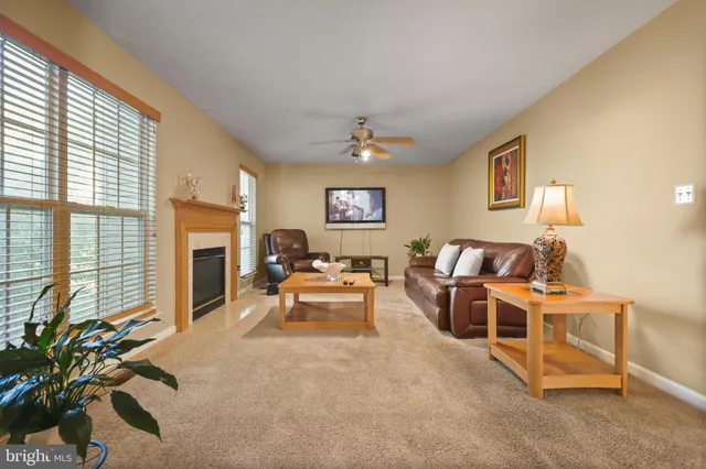 a living room with furniture with a window
