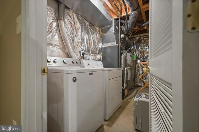 a view of a dining room with furniture and a chandelier