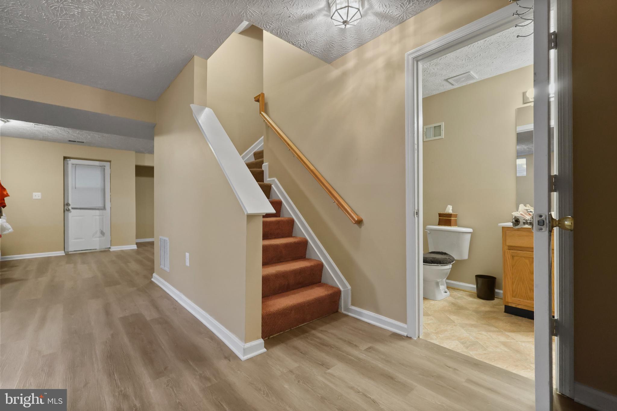 9716 Penguin Place Upper Marlboro, MD 20772 - Photo 50 of 84 a view of entryway and hall with wooden floor