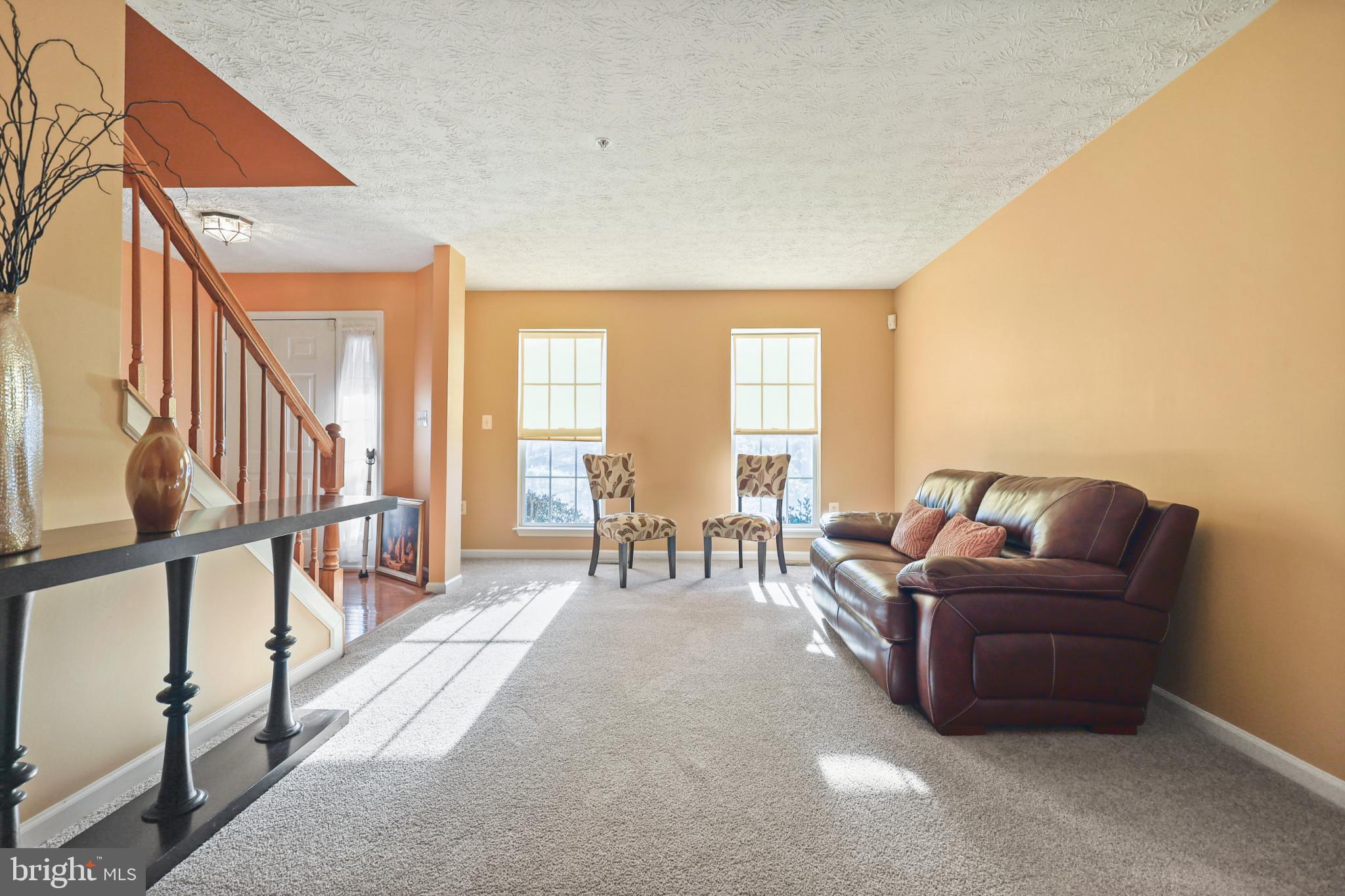 9716 Penguin Place Upper Marlboro, MD 20772 - Photo 65 of 84 a living room with furniture and a dining table with wooden floor