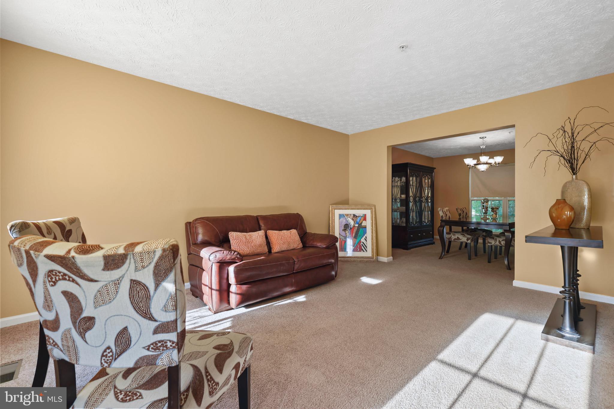 9716 Penguin Place Upper Marlboro, MD 20772 - Photo 69 of 84 a living room with furniture and a table