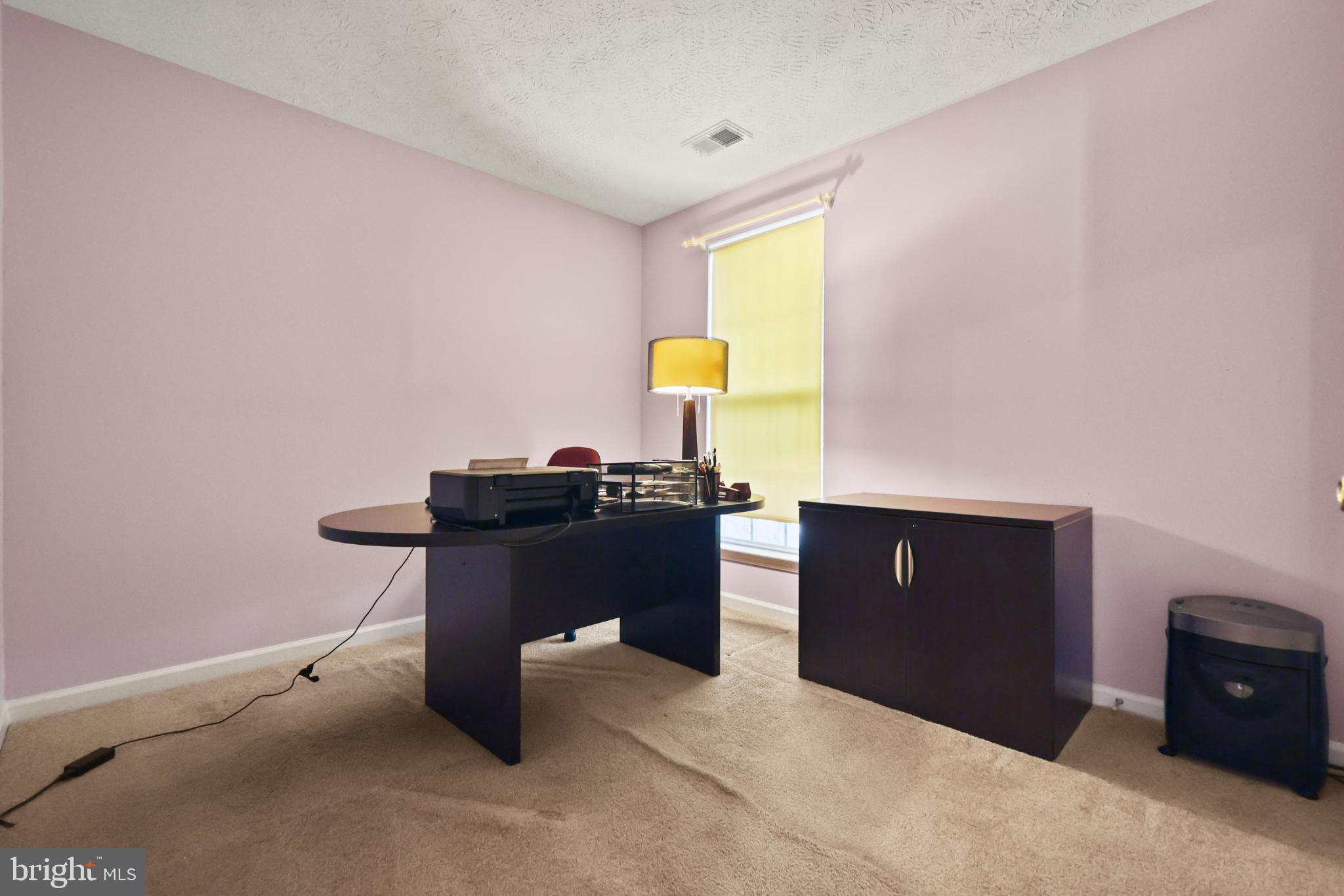 9716 Penguin Place Upper Marlboro, MD 20772 - Photo 7 of 84 a room with a desk and chair