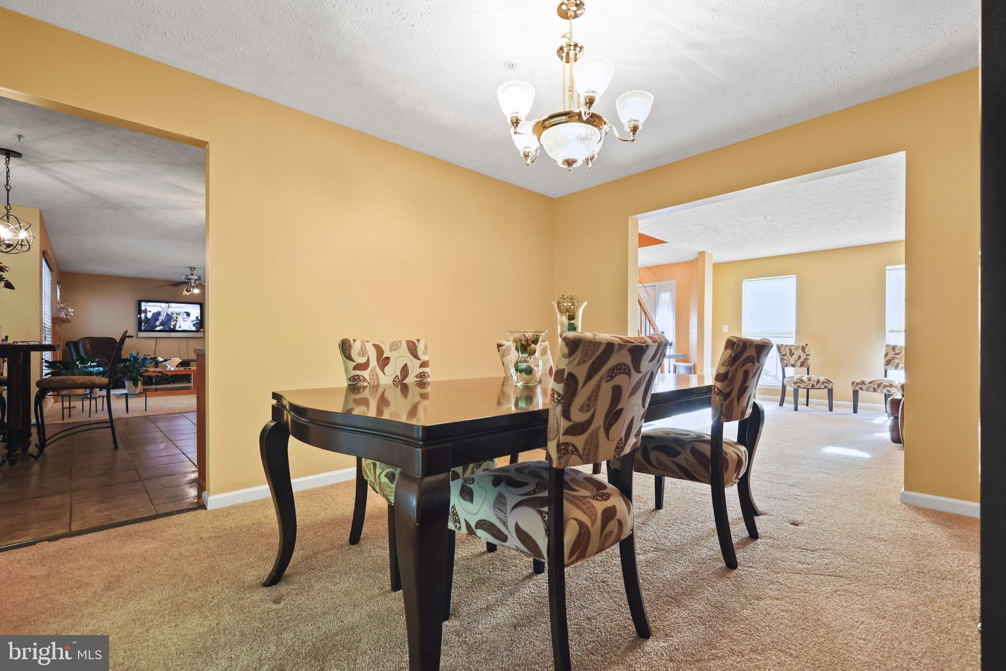 9716 Penguin Place Upper Marlboro, MD 20772 - Photo 74 of 84 a view of a dining room with furniture and wooden floor