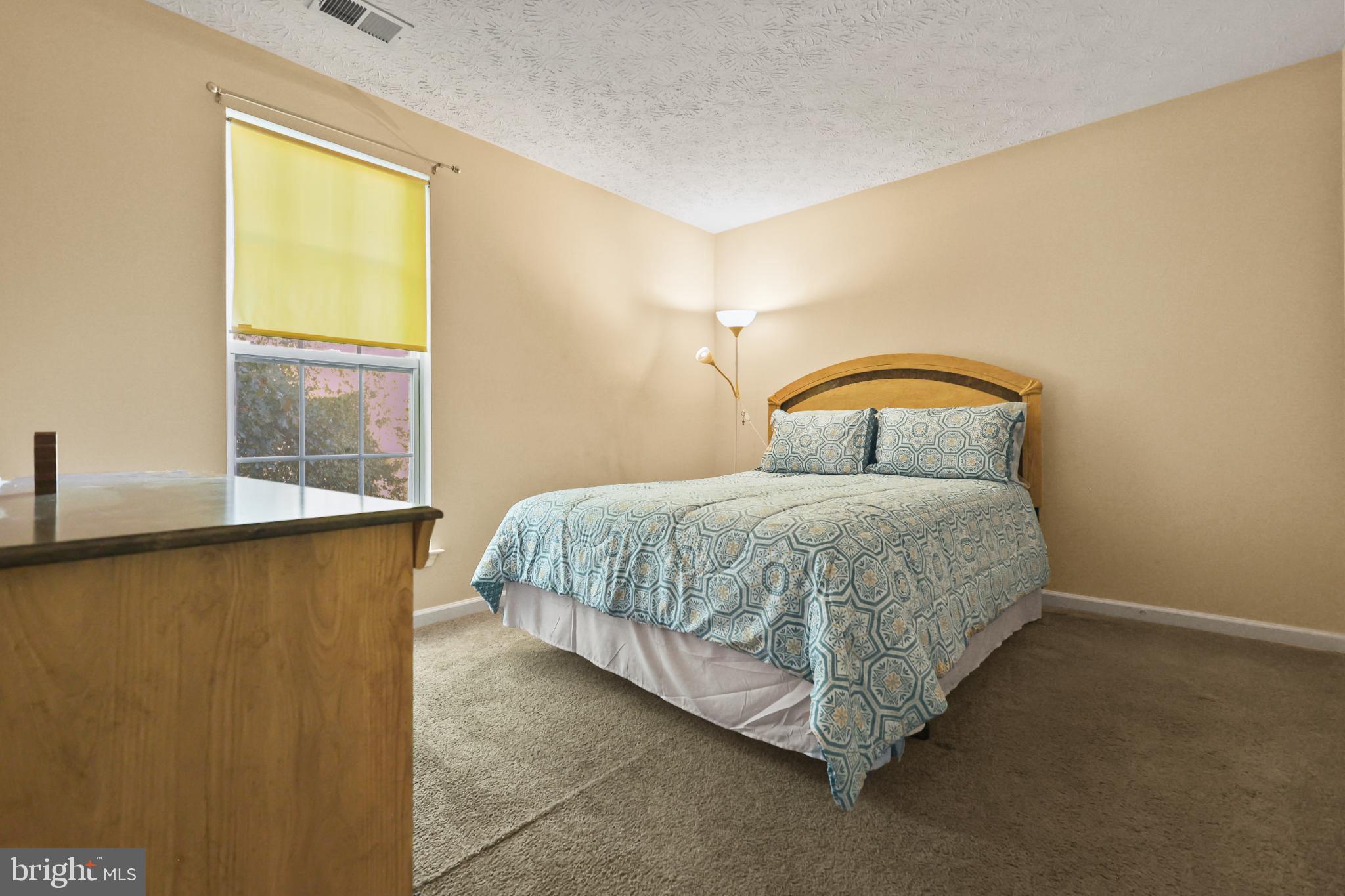 9716 Penguin Place Upper Marlboro, MD 20772 - Photo 8 of 84 a bedroom with a bed and window