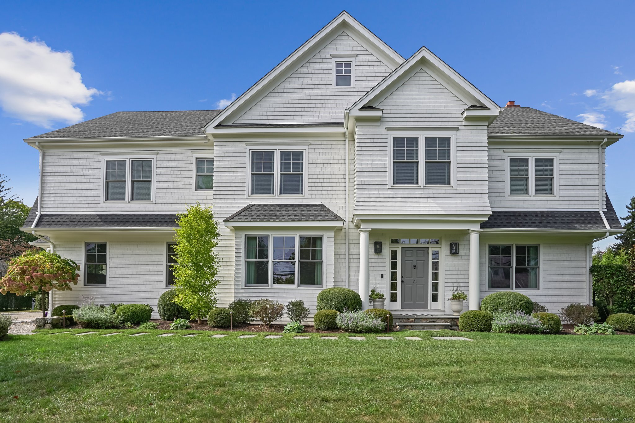 a front view of a house with a yard