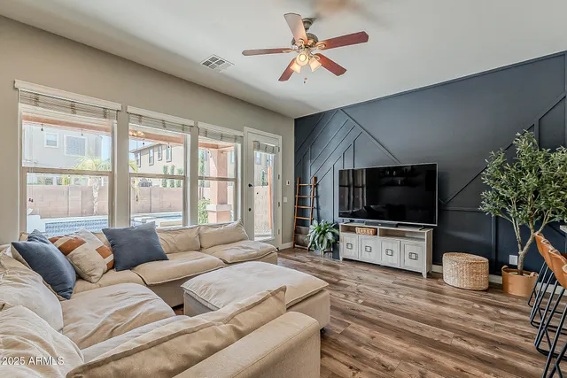 a living room with furniture and a large window