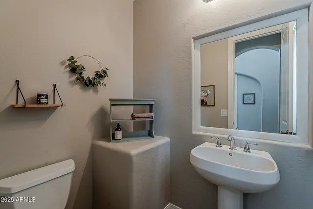 a bedroom with a large bed and a large window