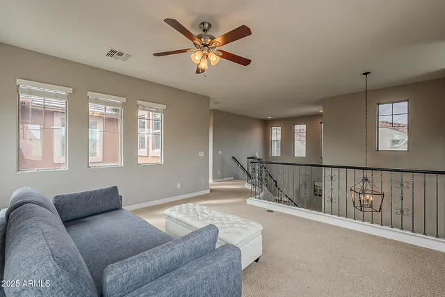 a bathroom with a sink a toilet and a large mirror