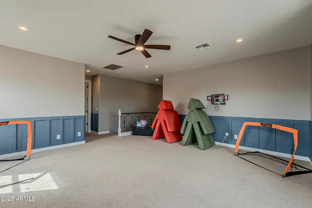 a bedroom with a bed and a chair