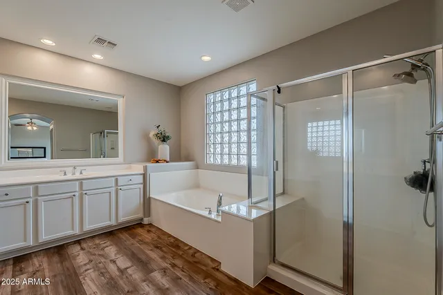 an aerial view of houses with a street