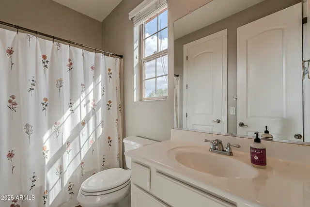 a view of a swimming pool with a table and chairs