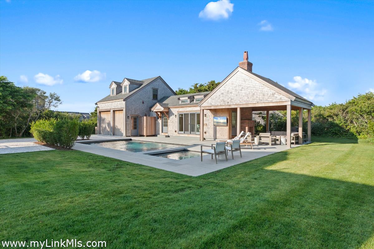 3 Tautemo Way Nantucket, MA 02554 - Photo 6 of 57 a front view of a house with garden and patio