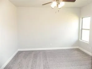 a view of a small space with fan