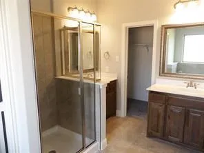 a bathroom with a shower and a sink
