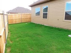 a view of a backyard with a garden