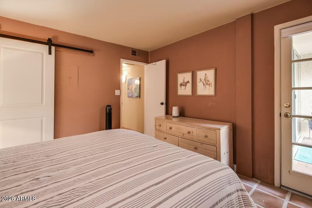 7625 East Camelback Road, Unit B117 Scottsdale, AZ 85251 - Photo 17 of 27 a bedroom with a large bed and a window