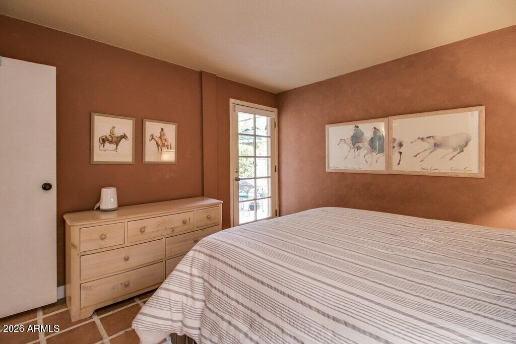 7625 East Camelback Road, Unit B117 Scottsdale, AZ 85251 - Photo 18 of 27 a bedroom with a bed and a window