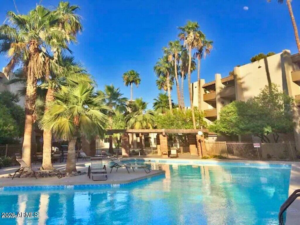 7625 East Camelback Road, Unit B117 Scottsdale, AZ 85251 - Photo 22 of 27 a view of swimming pool with outdoor seating
