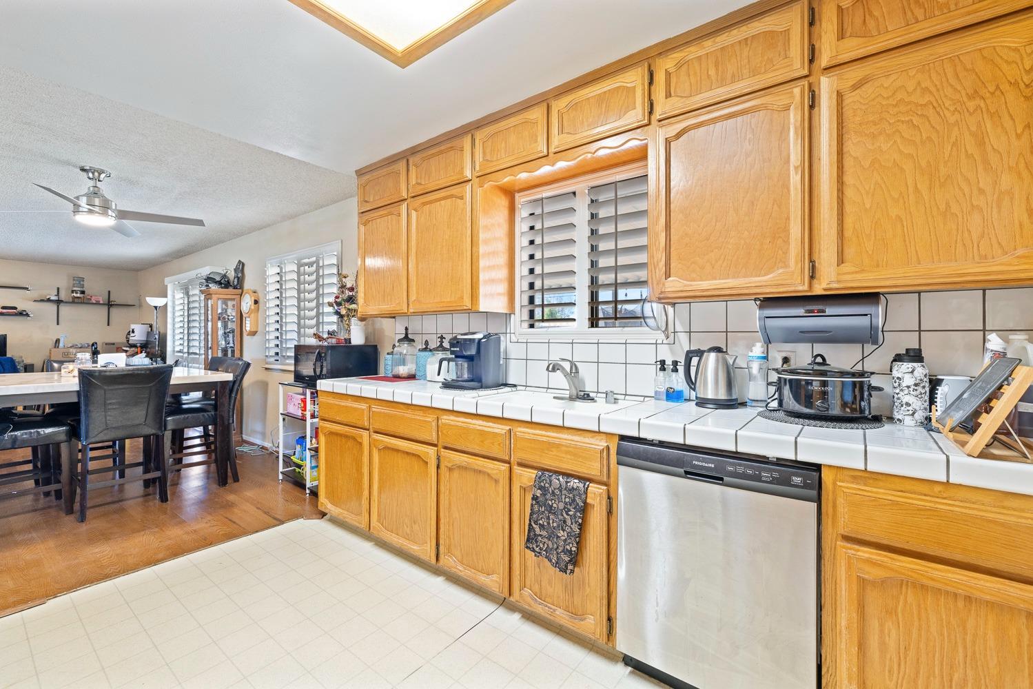 18800 Midland Way Madera, CA 93638 - Photo 11 of 27 a kitchen with stainless steel appliances granite countertop sink stove and cabinets