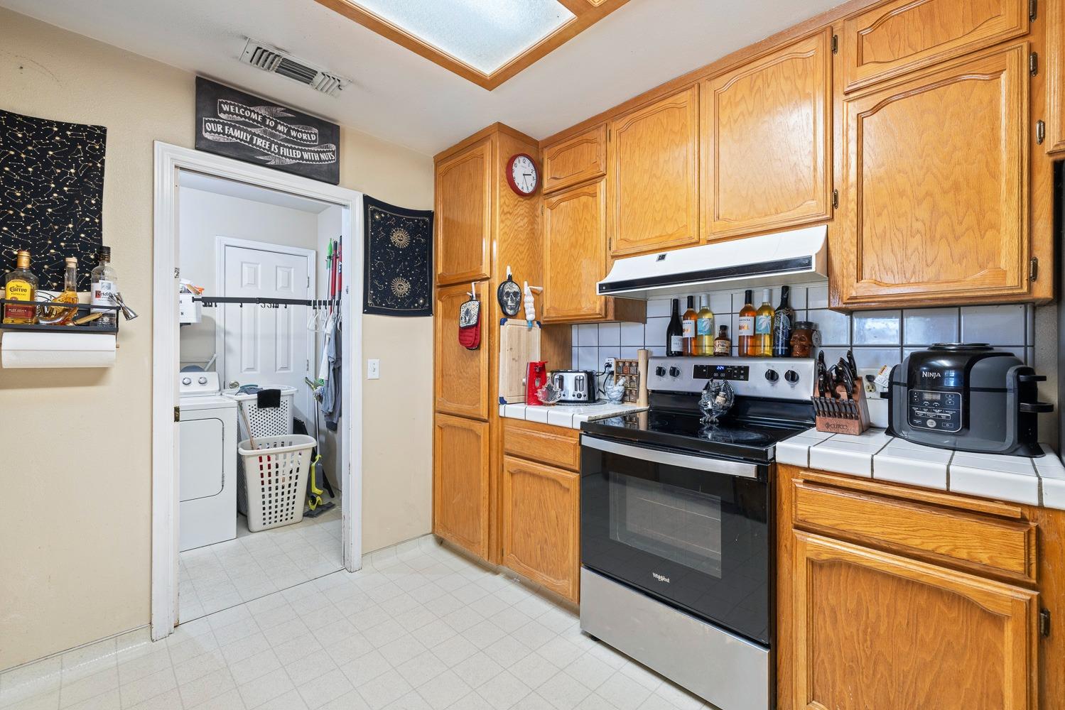 18800 Midland Way Madera, CA 93638 - Photo 12 of 27 a kitchen with stainless steel appliances granite countertop a refrigerator and a stove top oven