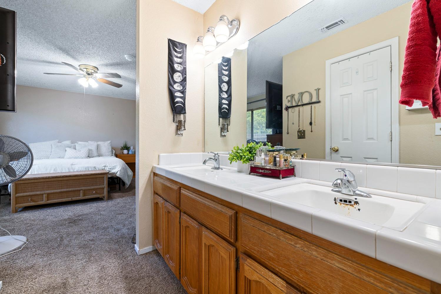 18800 Midland Way Madera, CA 93638 - Photo 14 of 27 a bathroom with a double vanity sink mirror and