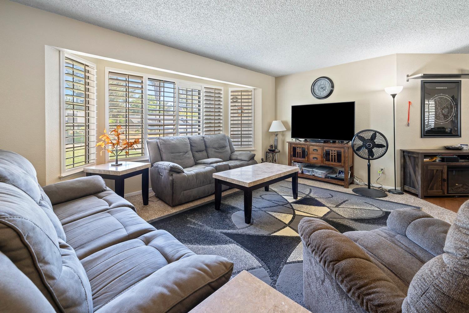 18800 Midland Way Madera, CA 93638 - Photo 6 of 27 a living room with furniture and a flat screen tv