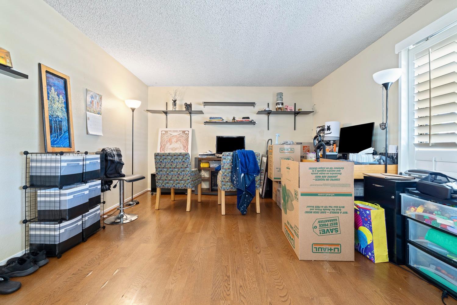 18800 Midland Way Madera, CA 93638 - Photo 7 of 27 a room with furniture a flat screen tv and a fireplace