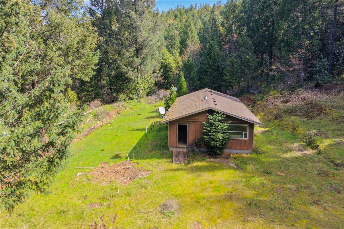 2787 Davis Creek Road Selma, OR 97538 - Photo 1 of 22 a aerial view of a house with swimming pool