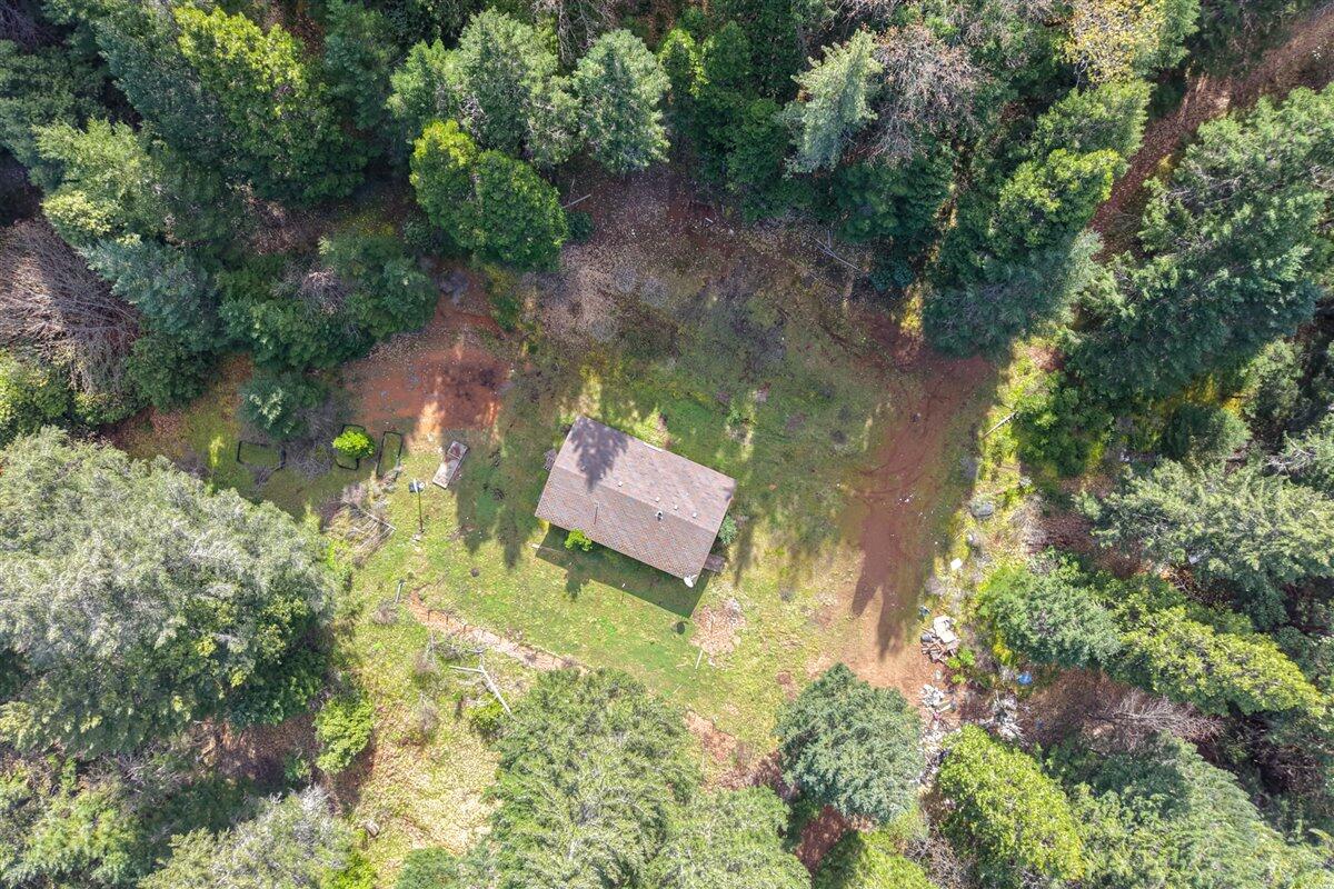 2787 Davis Creek Road Selma, OR 97538 - Photo 2 of 22 an aerial view of a house with a yard basket ball court and outdoor seating