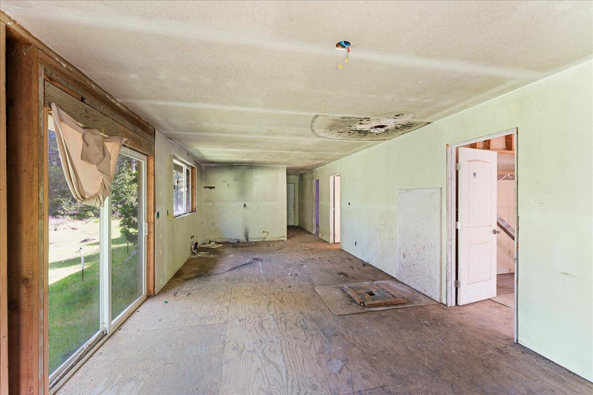 2787 Davis Creek Road Selma, OR 97538 - Photo 8 of 22 a view of a hallway with windows