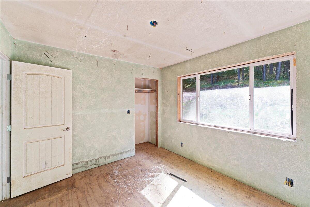 2787 Davis Creek Road Selma, OR 97538 - Photo 10 of 22 a view of an empty room with a window